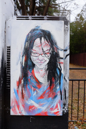 Graffito: girl in red and blue
