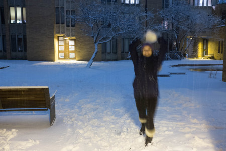 Clara Steinhagen wielding snow in the Massey College quad