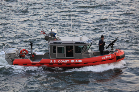 Coast Guard boat with mounted machine gun
